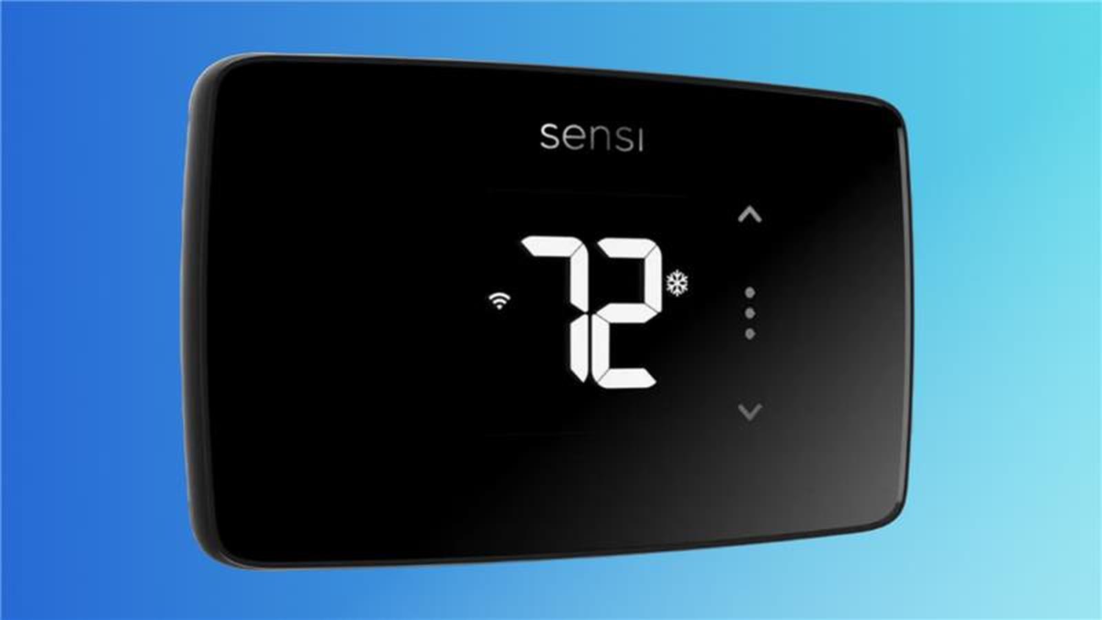Black digital thermostat displaying 72 degrees, with arrow buttons and Wi-Fi symbol.